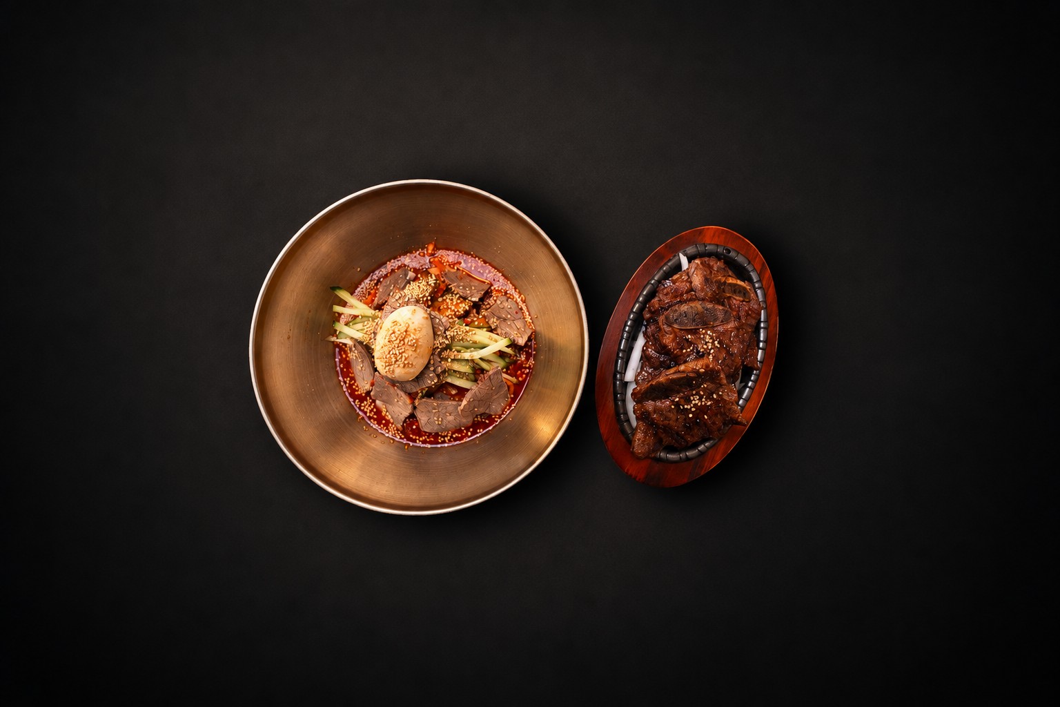 A noodle bowl paired with a platter of grilled meat